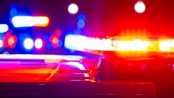 Red and blue flashing police lights at a crime scene.